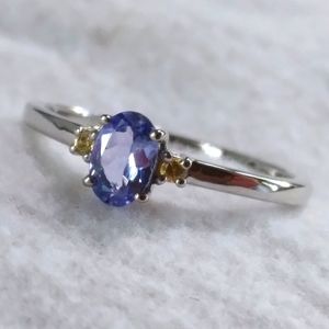 Tanzanite solitaire with yellow sapphire accent sterling silver ring